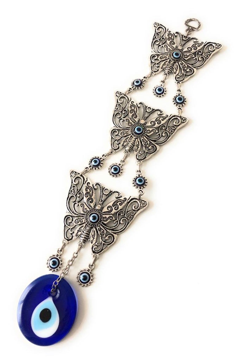 Butterfly wall hanging with evil eye beads